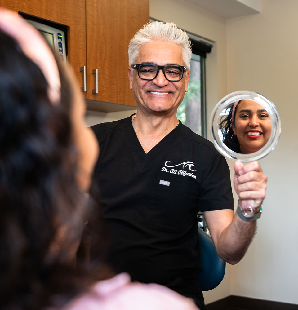 dr ali with iris during big dental implant reveal