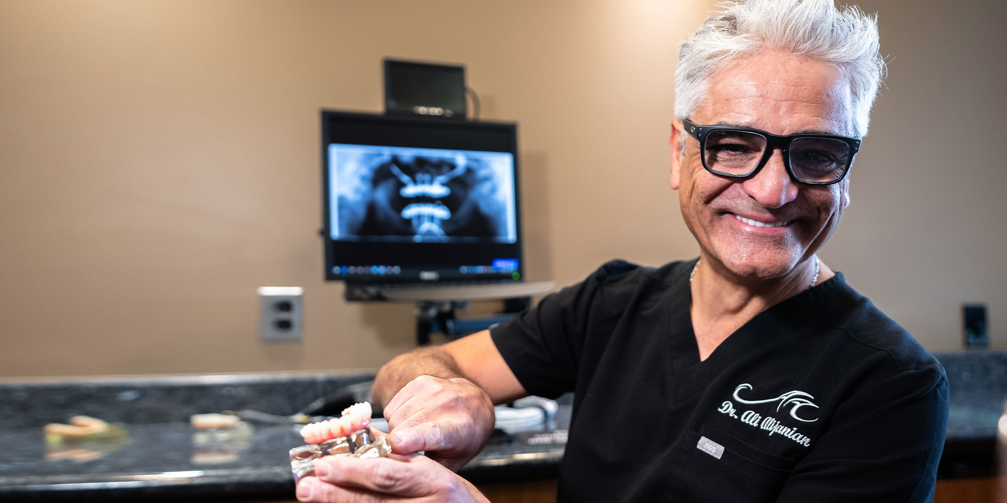 dr ali showing dental implants