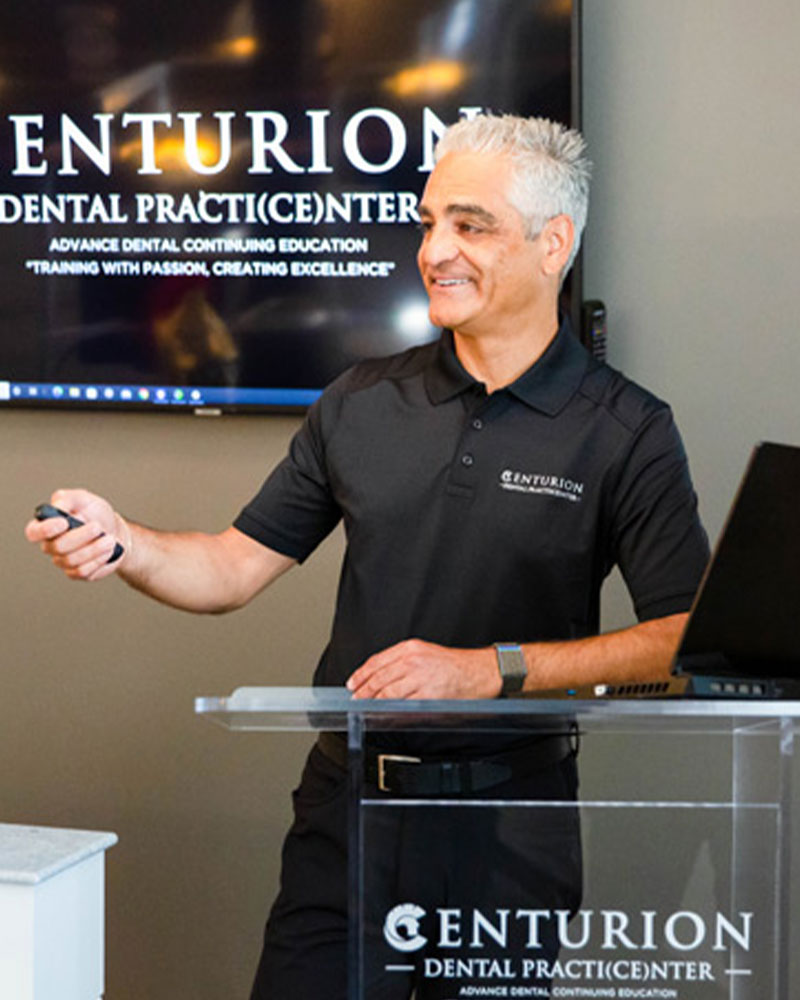 dr ali with clicker at centurion during lecture
