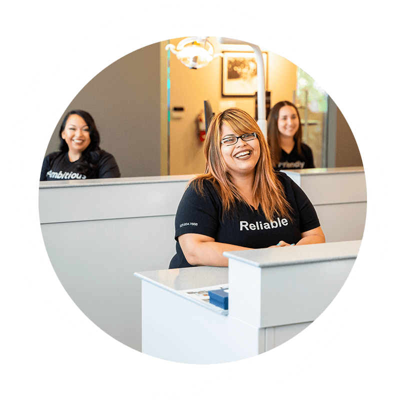 team members smiling and laughing